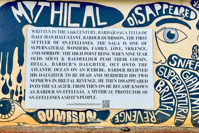 Street Art in Iceland 17 A mural with the words “MYTHICAL” and “DISAPPEARED” surrounds a large sign describing the 14th-century Bárðar saga about Bárður Dumbsson, a half-man half-giant, and his connection to Snaefellsnes folklore.